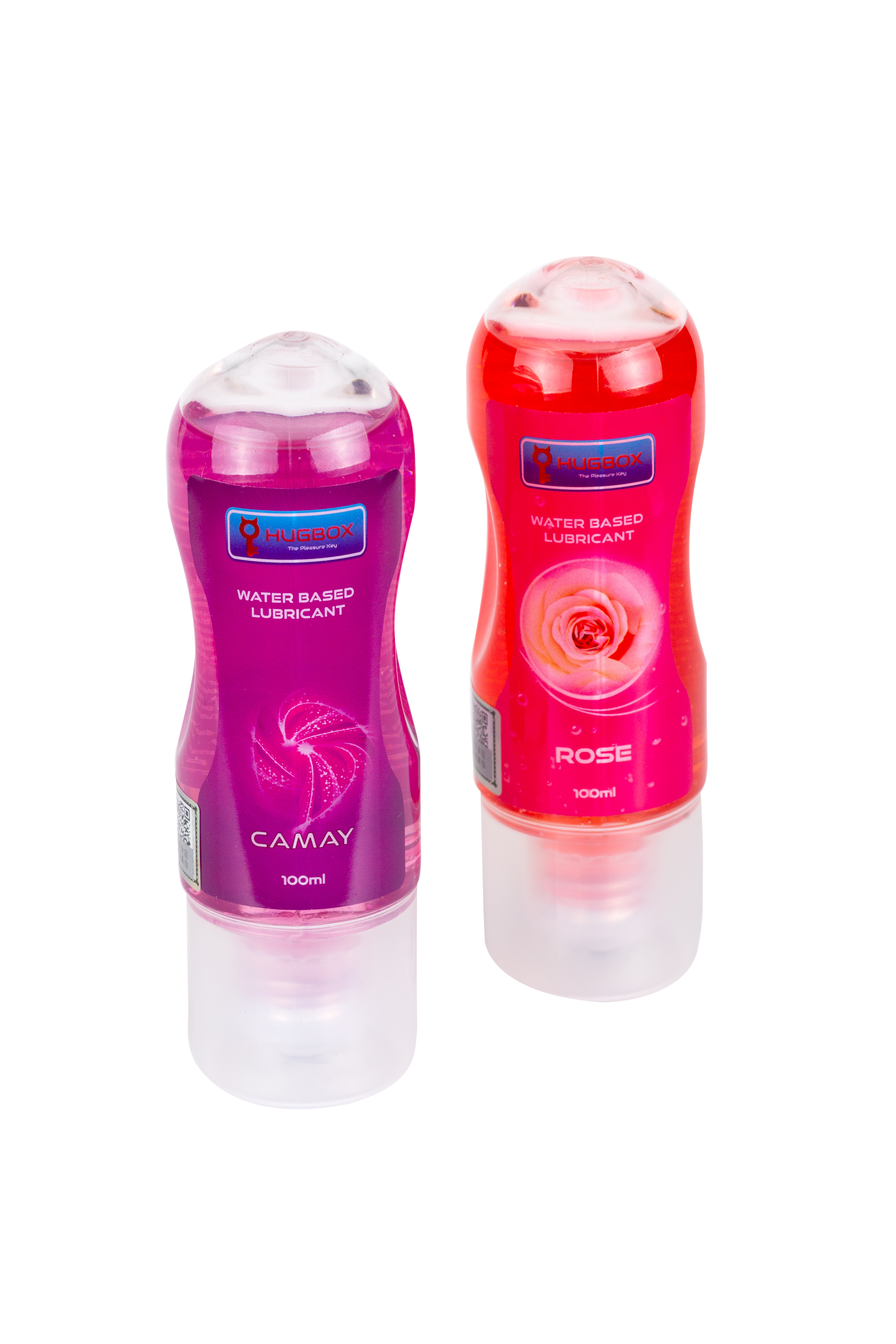 Dos botellas de lubricante lado a lado. Una morada, una roja, ambas con tapones transparentes y etiquetas blancas.