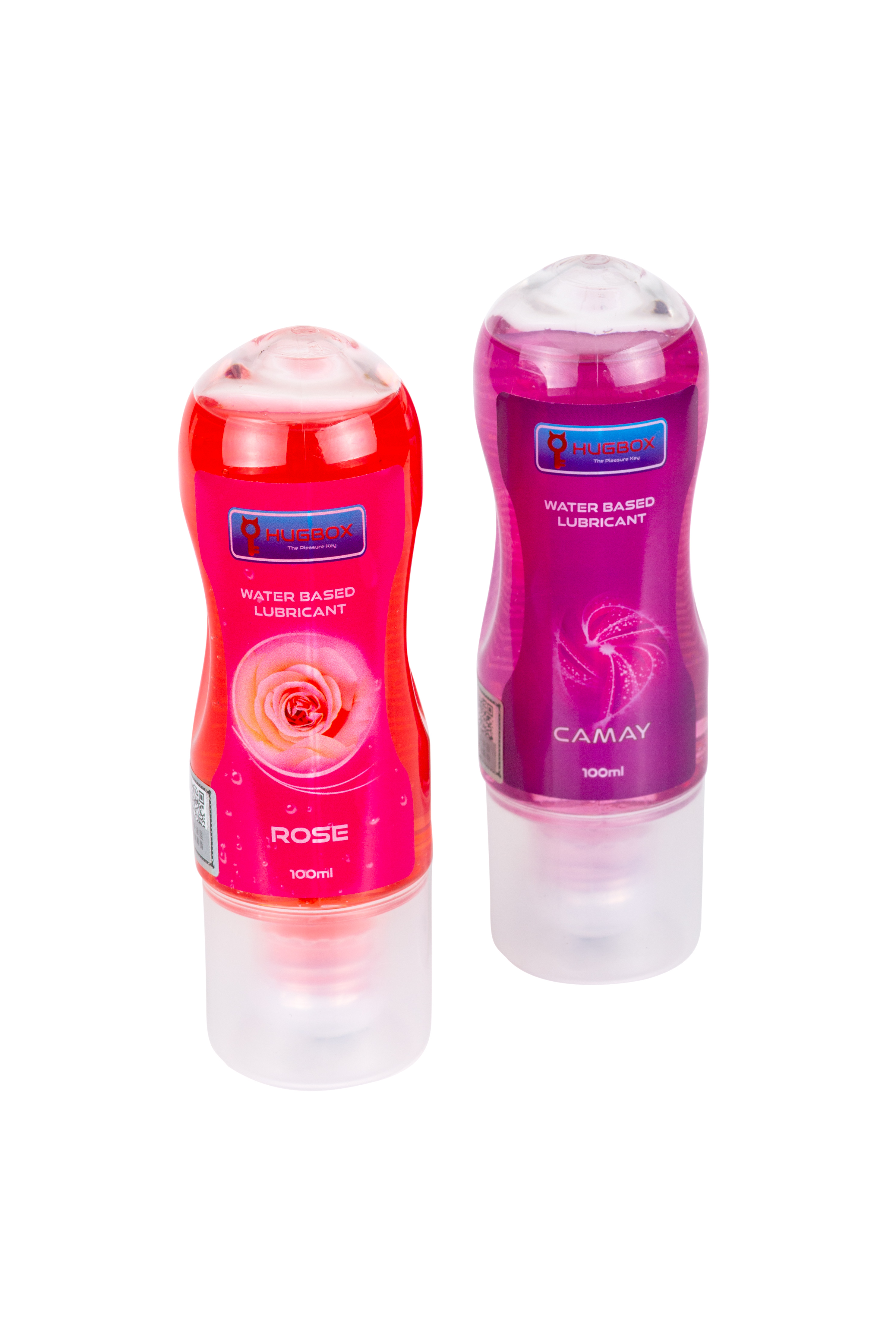 Dos botellas de lubricante sobre una superficie blanca. Una roja, otra morada.