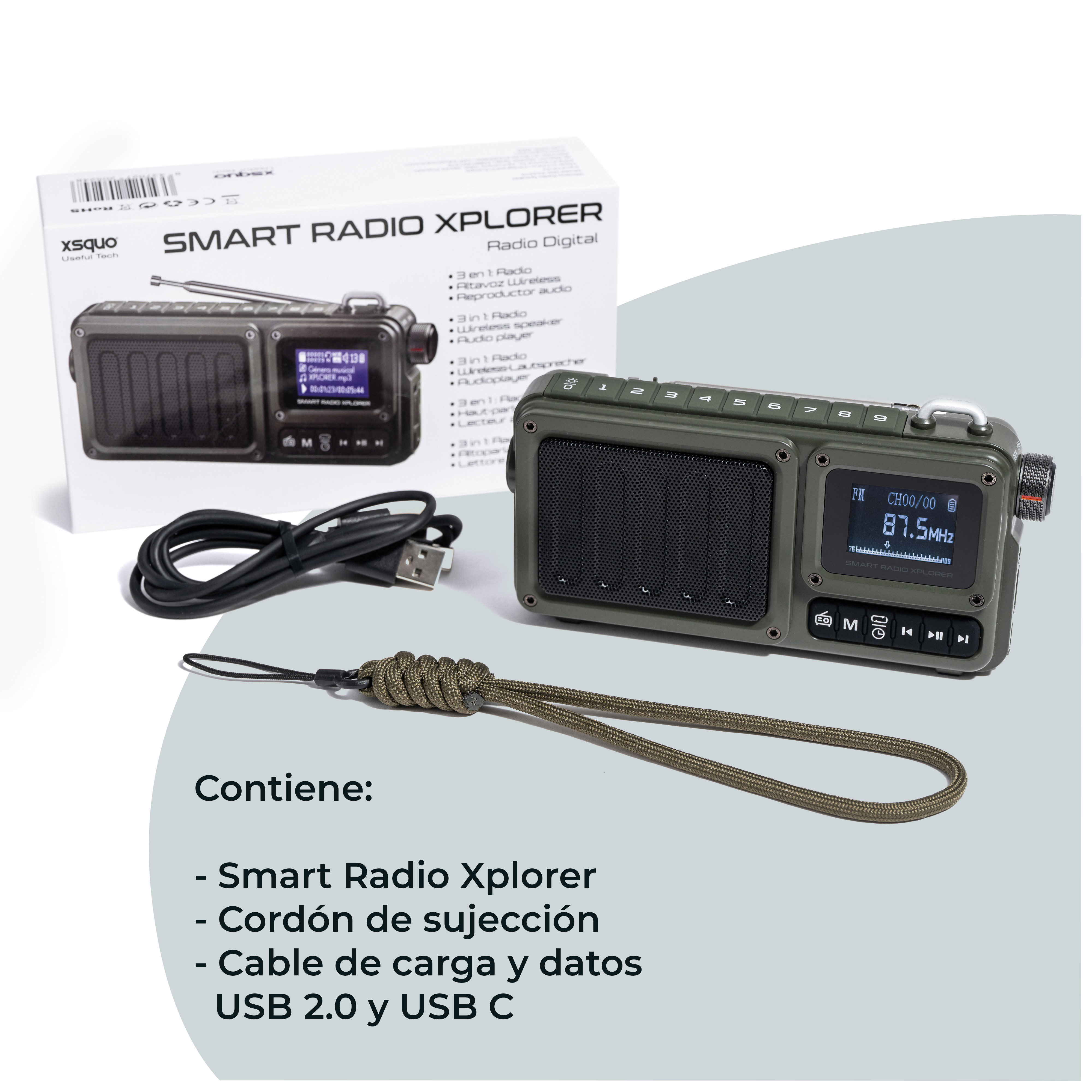 Radio en caja blanca con cable de carga y teléfono. La caja tiene texto en español.