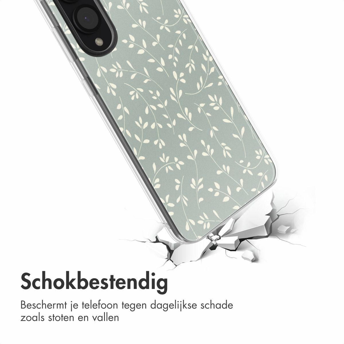 Een telefoonhoesje met een groen en wit bloemenpatroon valt, met scheuren.