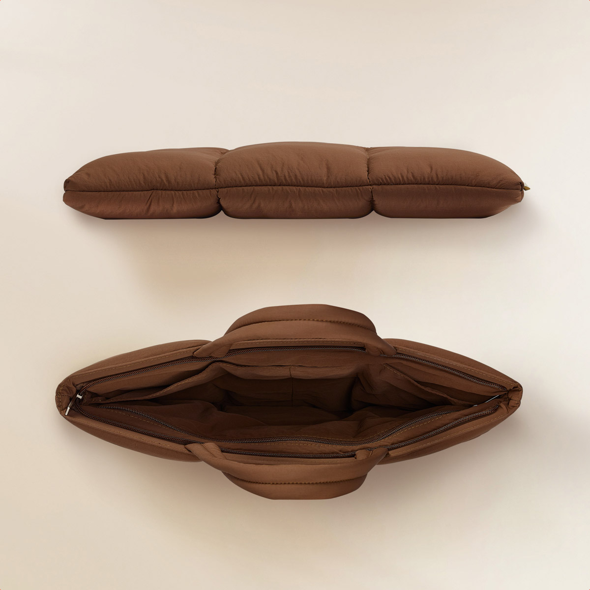 Top-down view of a brown quilted tote bag and a separate rectangular padded piece, both on a light background.