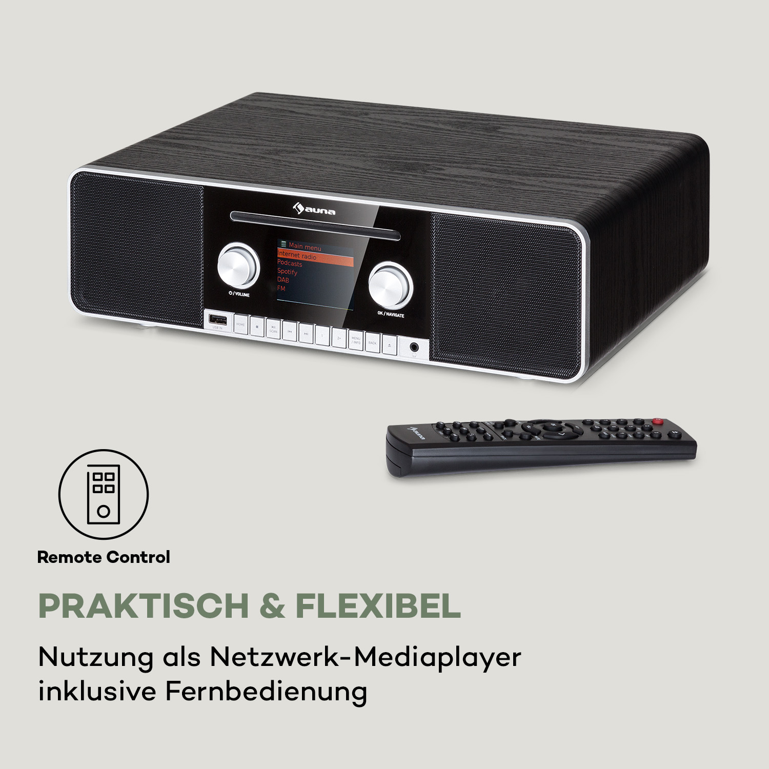 Schwarzes Radio mit holzähnlichen Seiten. Eine Fernbedienung liegt davor. Das Display zeigt Multimedia-Optionen.