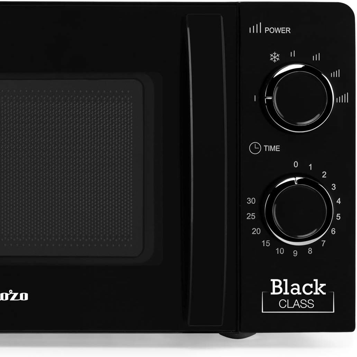 Zbliżenie czarnej kuchenki mikrofalowej z cyfrowym wyświetlaczem i pokrętłami.