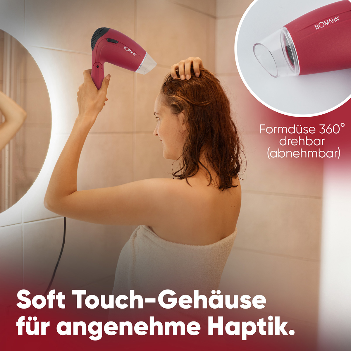 Kobieta używa czerwonej suszarki do włosów, w tle lustro. Tekst: Soft Touch-Gehäuse für angenehme Haptik.