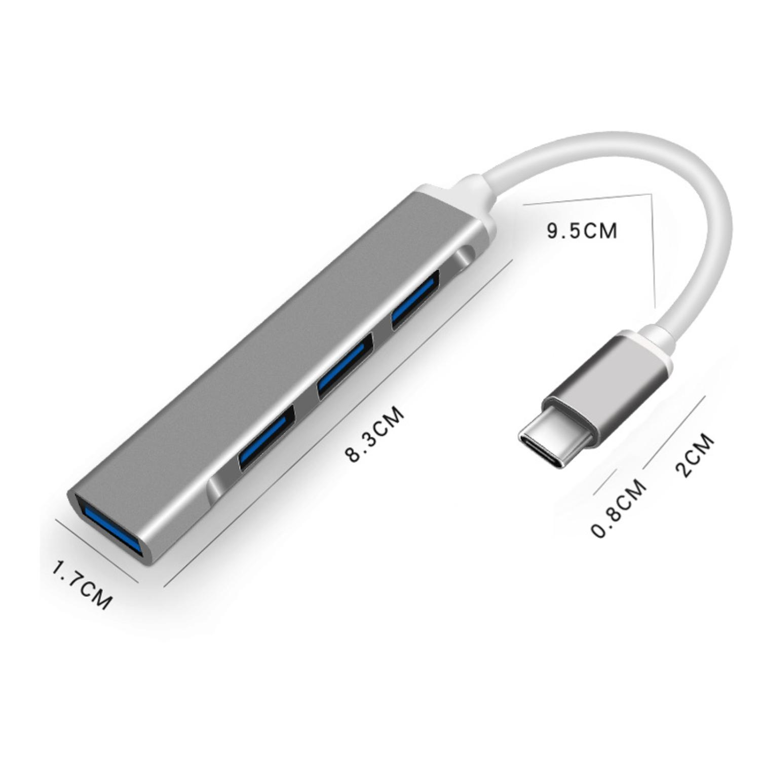 Ein silberner USB-Hub mit vier blauen USB-Anschlüssen, der an einen USB-C-Anschluss angeschlossen ist.