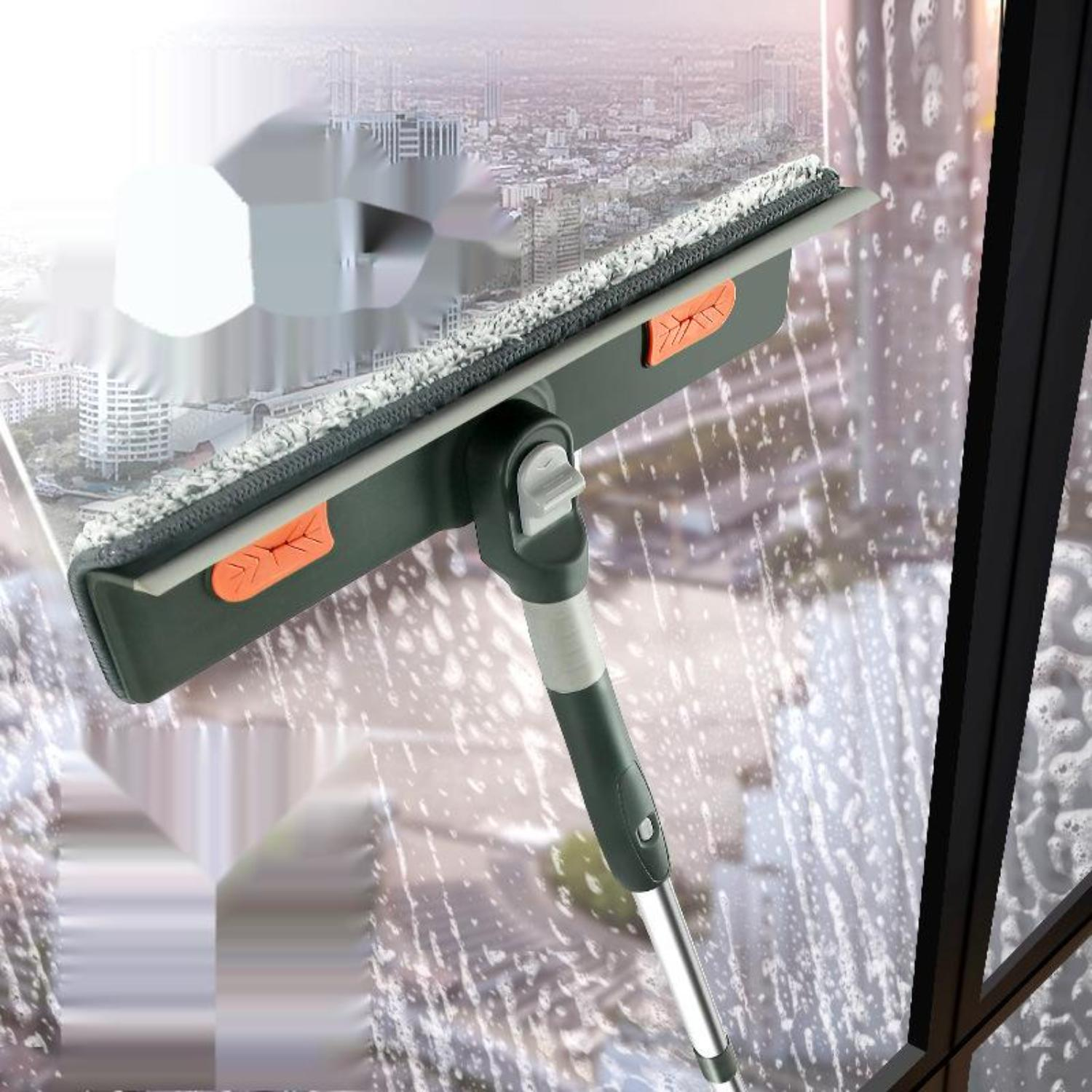 Ein Fenster, das mit einem Abzieher gereinigt wird, mit einer Stadtlandschaft durch das Fenster sichtbar.