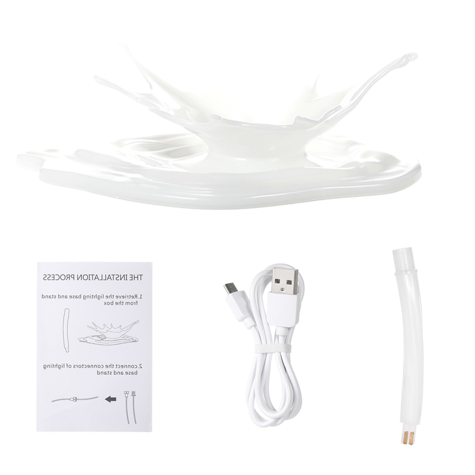 Diagramm einer Spritzdesign-Lampe. Es zeigt die Lampe, das Kabel und das Zubehör.