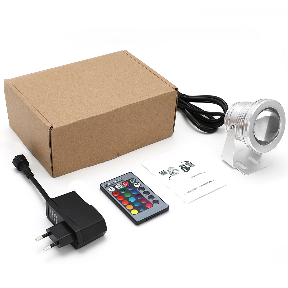 Box mit Unterwasserlicht, Fernbedienung, Netzteil und Anleitung. Weißer Hintergrund.