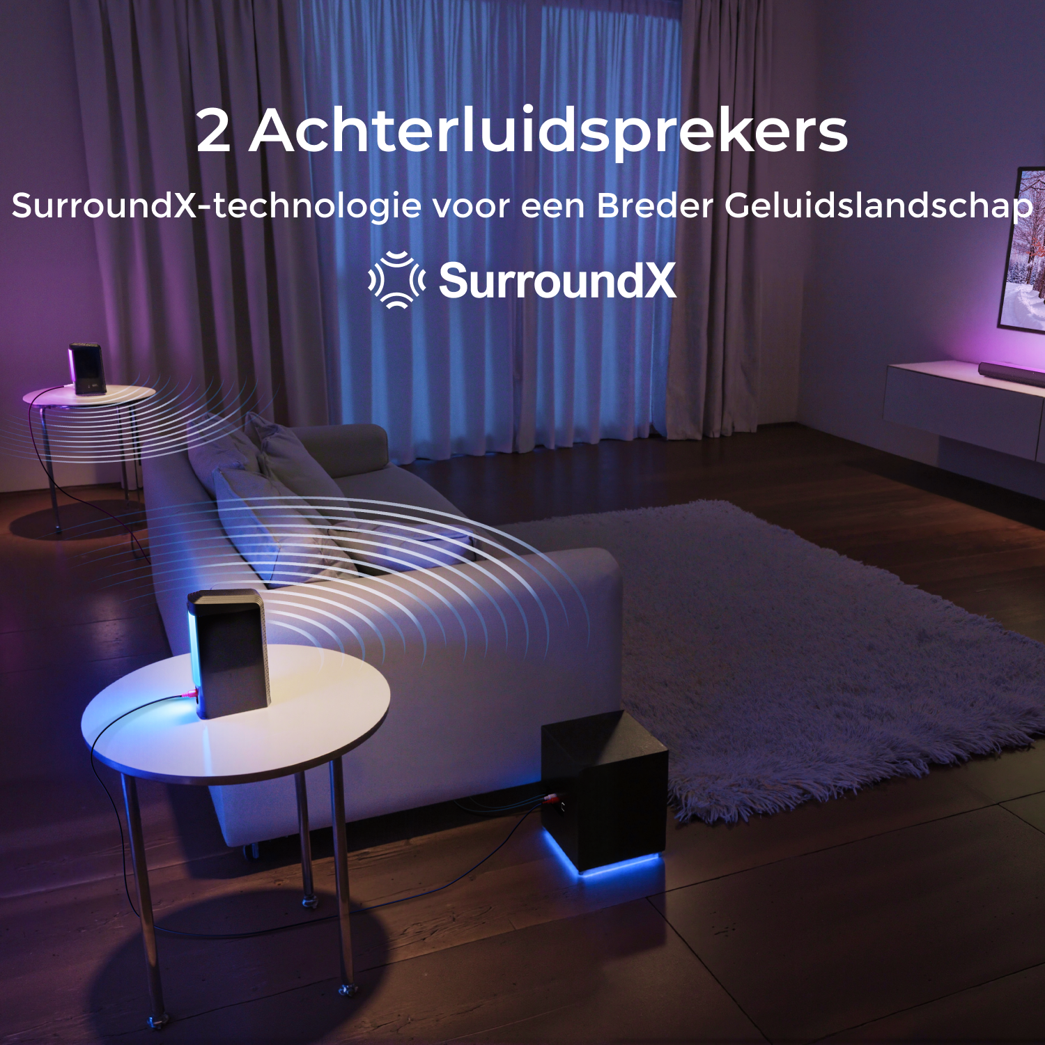 Living room with a TV, sound system, and speakers on side tables. Text: 2 rear speakers, SurroundX technology.