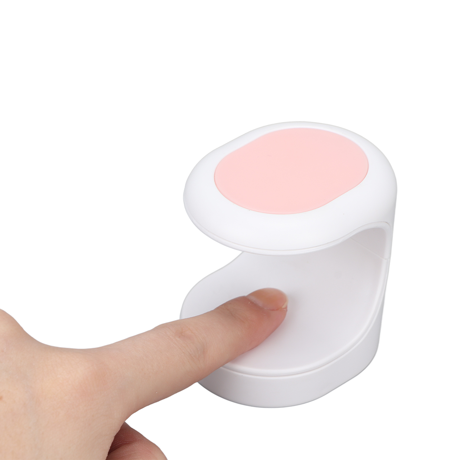 Ein weißer und rosa Nageltrockner, mit einem Finger eingeführt, auf weißem Hintergrund.
