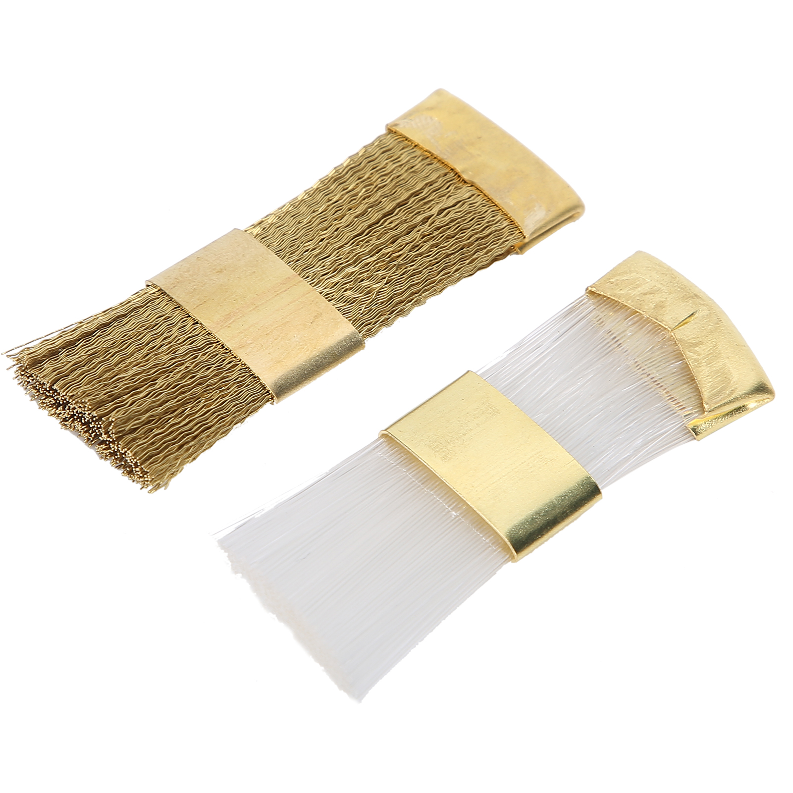 Zwei diagonal liegende Bürsten, eine mit goldenen Bändern und goldenen Borsten, und eine mit weißen Borsten.