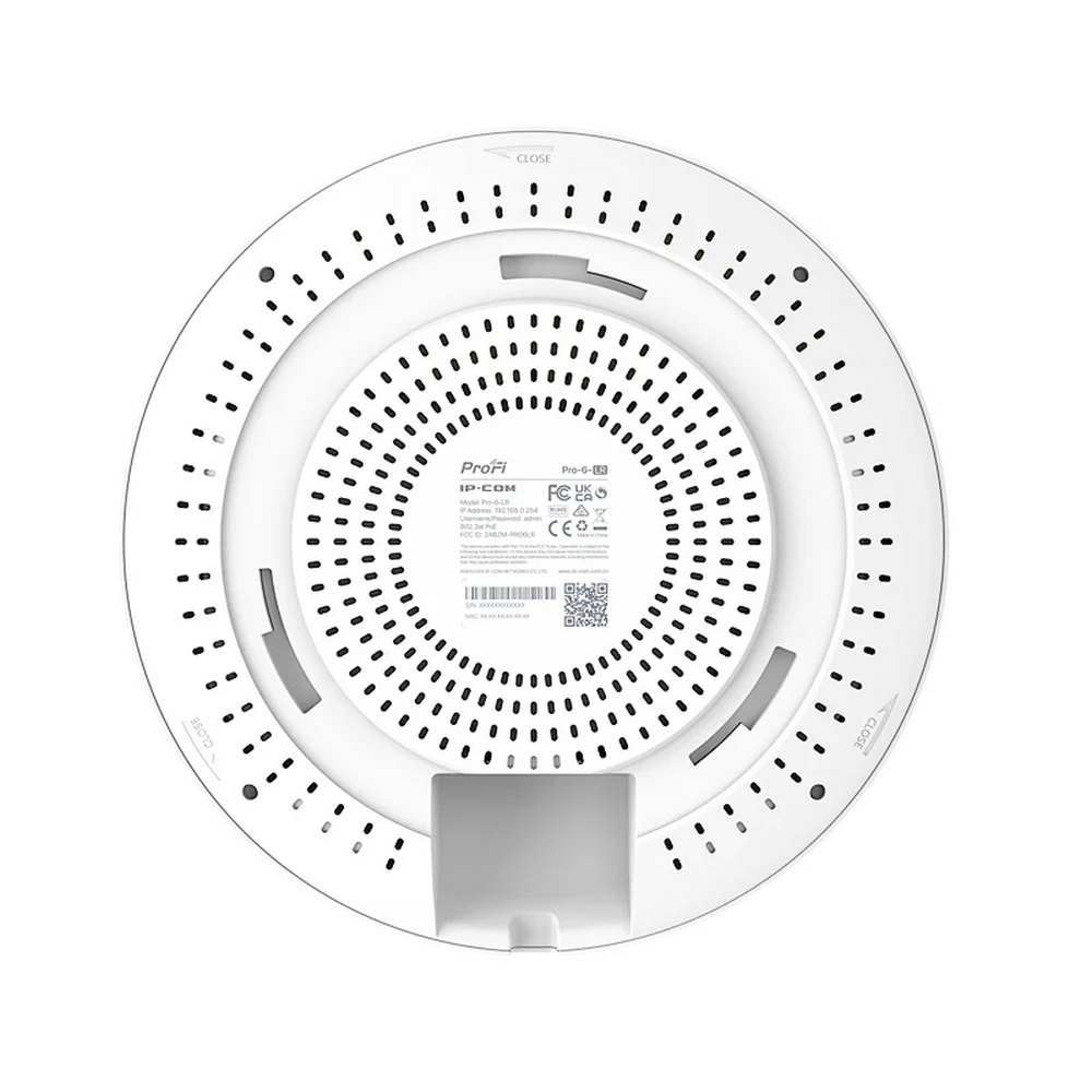 Weißes kreisförmiges Netzwerkgerät mit zentralen Perforationen und Etikettendetails. Es hat 'ProFi-6' und andere technische Daten.