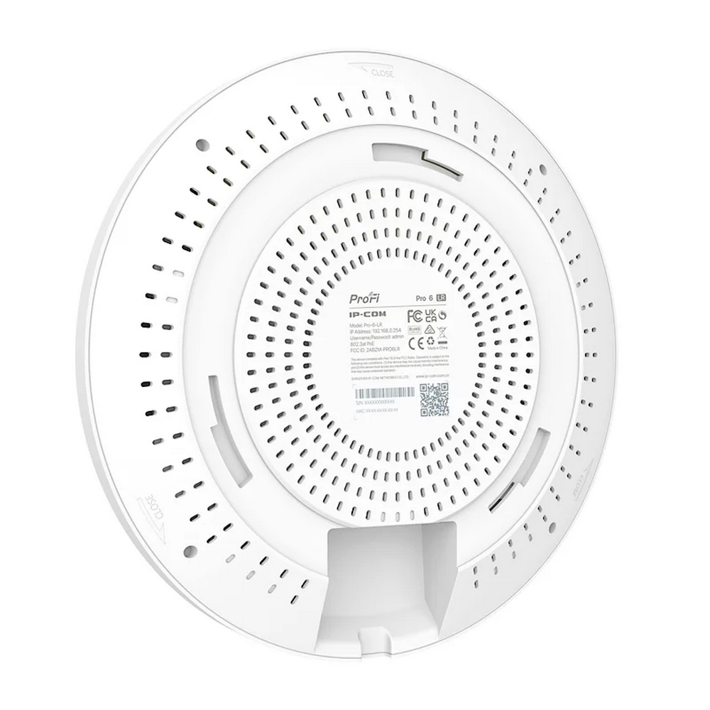Weißes kreisförmiges Netzwerkgerät mit Perforationen, Details auf der Rückseite. Enthält 'ProFi' und technische Markierungen.