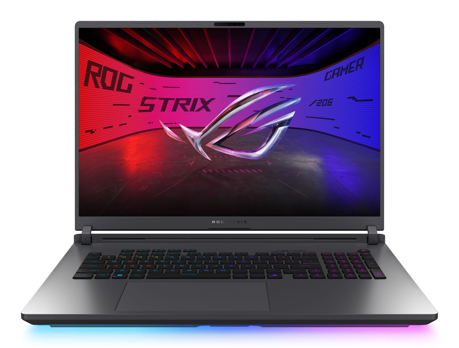 Otwarty laptop. Logo ROG Strix na ekranie. Klawiatura podświetlana RGB. Ciemnoszara obudowa. Czerwone i niebieskie tło ekranu.