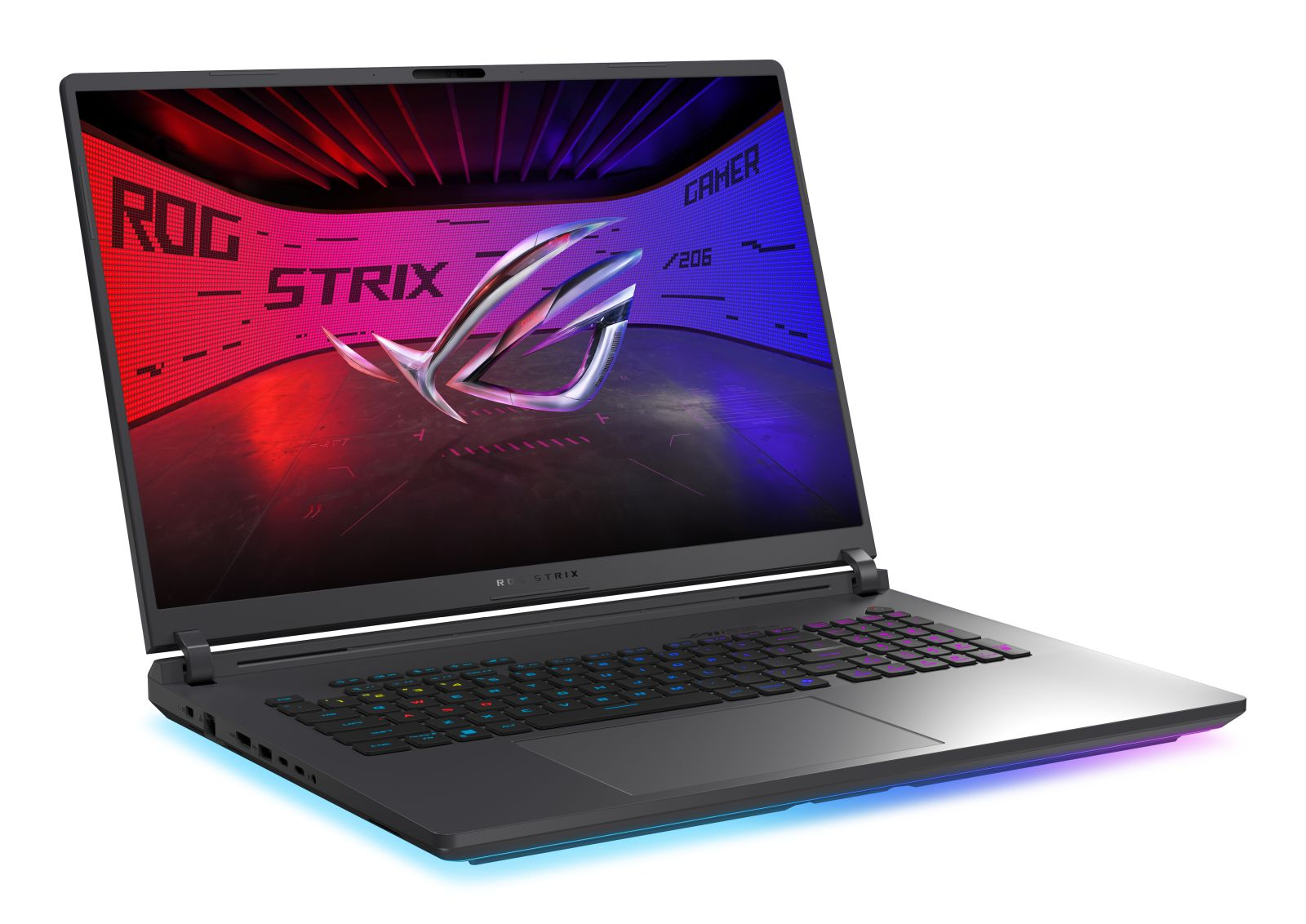 Otwarty laptop. Logo ROG Strix na ekranie. Klawiatura podświetlana RGB. Ciemnoszara obudowa. Czerwone i niebieskie tło ekranu.