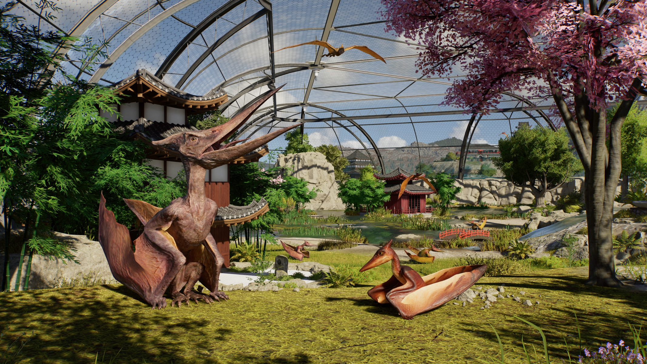 Pterodaktyle i inne dinozaury w parku o tematyce japońskiej z dużym wybiegiem.