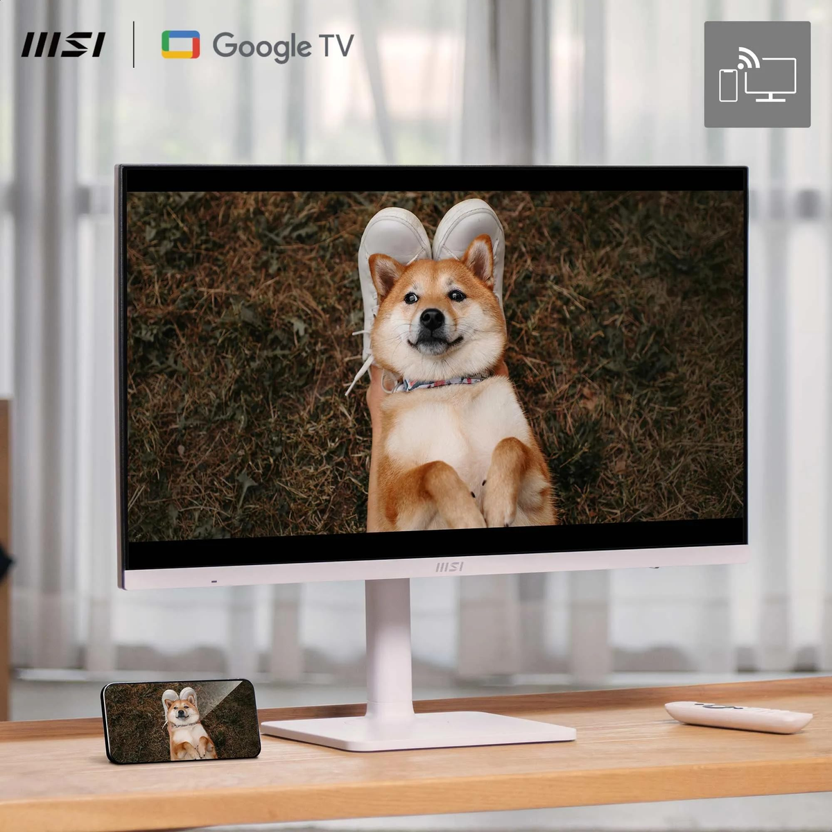 Un perro en una pantalla, acostado boca arriba. Al lado, un teléfono con la imagen del perro.