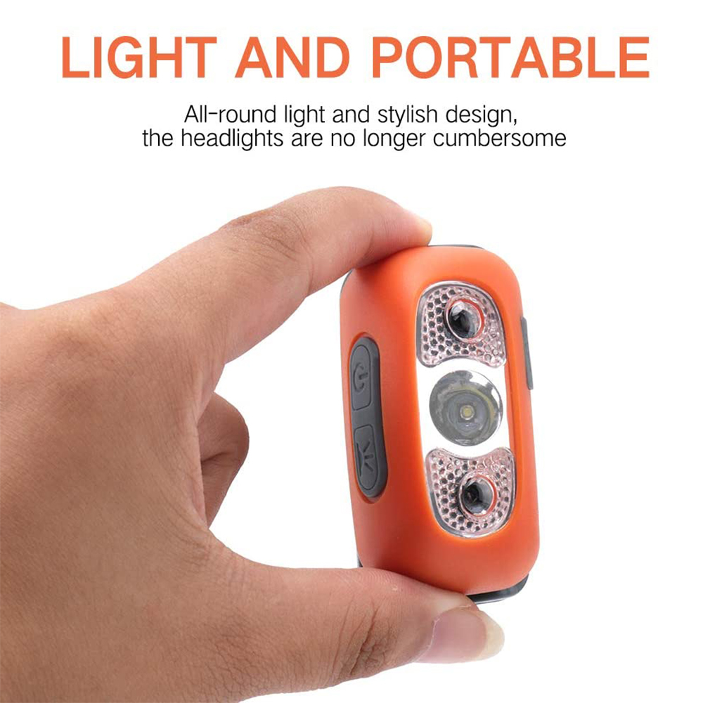 Eine kleine orangefarbene Stirnlampe in der Hand, mit zwei Lichtern und einem Ein-/Ausschalter. Das Design ist schlank und tragbar.