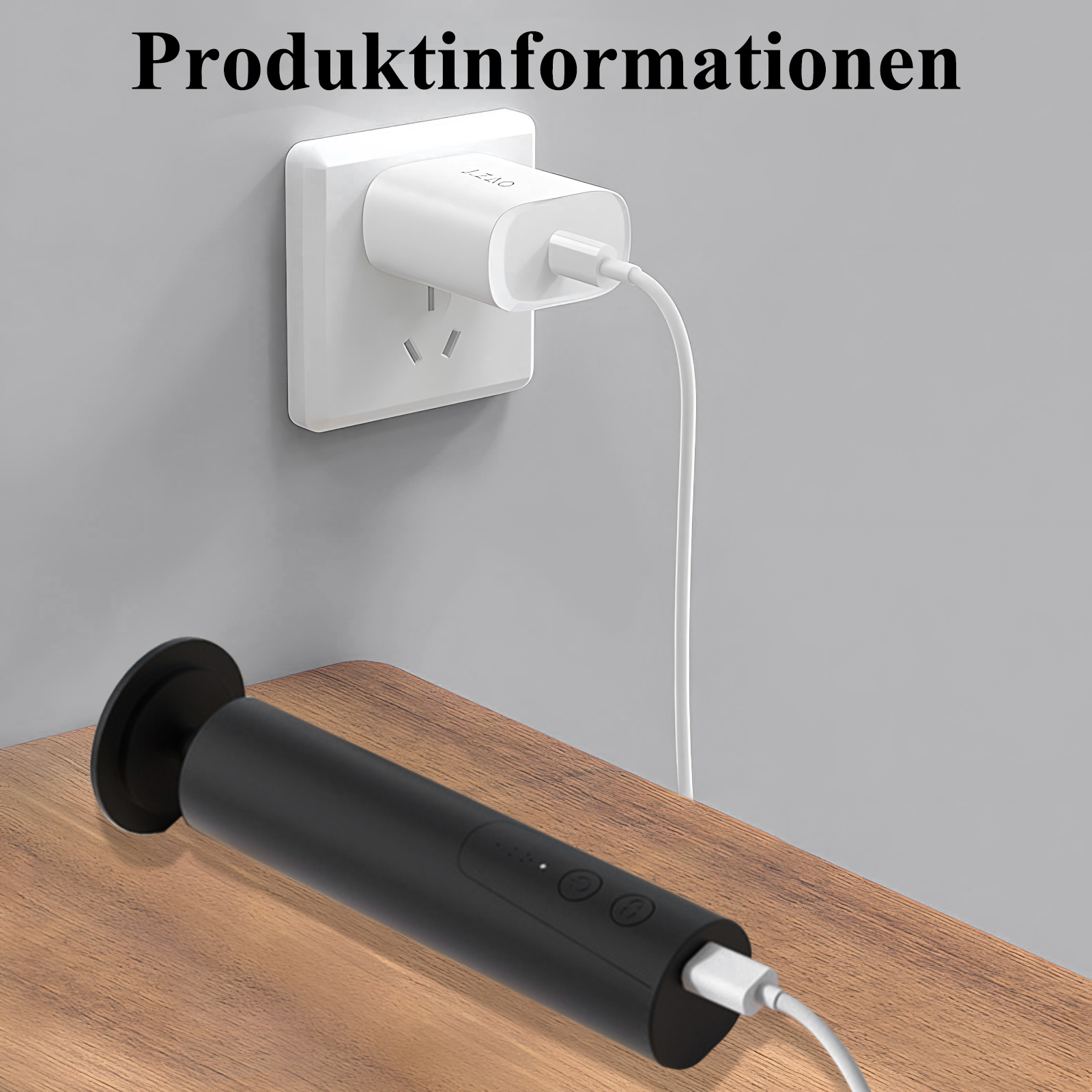 Schwarzes Ladegerät an der Steckdose, schwarzer Zylinder auf einem Holztisch.