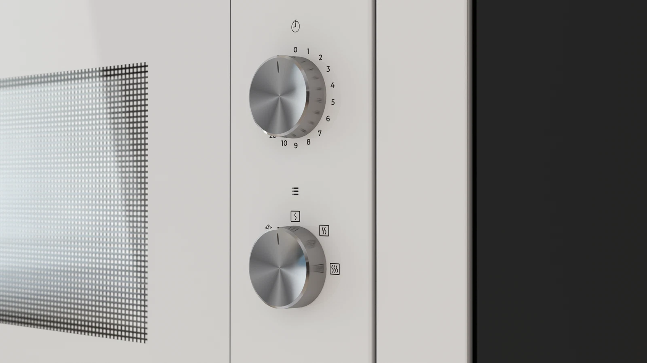 Sterowanie mikrofalówką: pokrętło czasu i pokrętło funkcji. Białe urządzenie z czarną ramą.