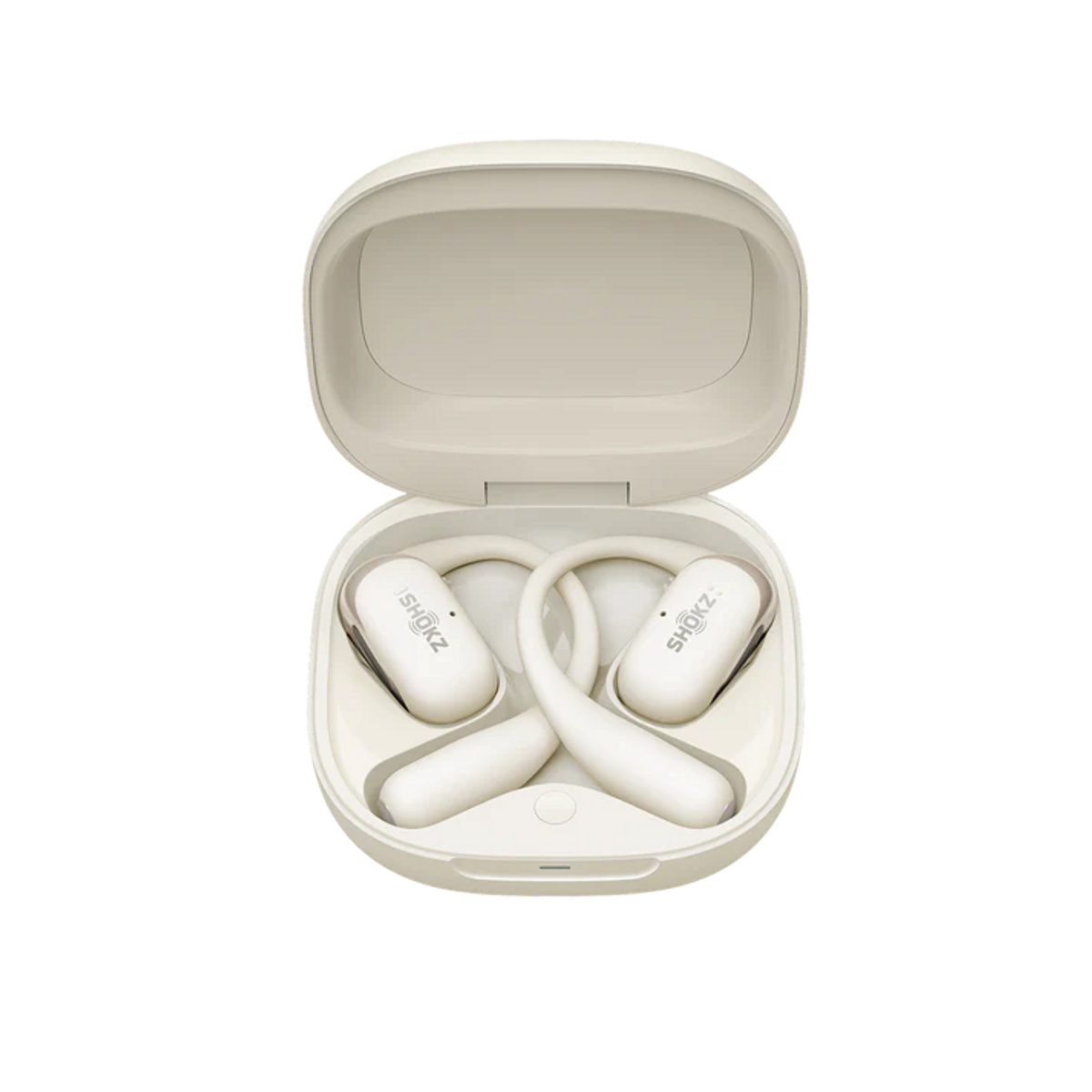 Białe słuchawki w otwartym beżowym etui. Etui jest na czarnym tle. Marka jest widoczna.