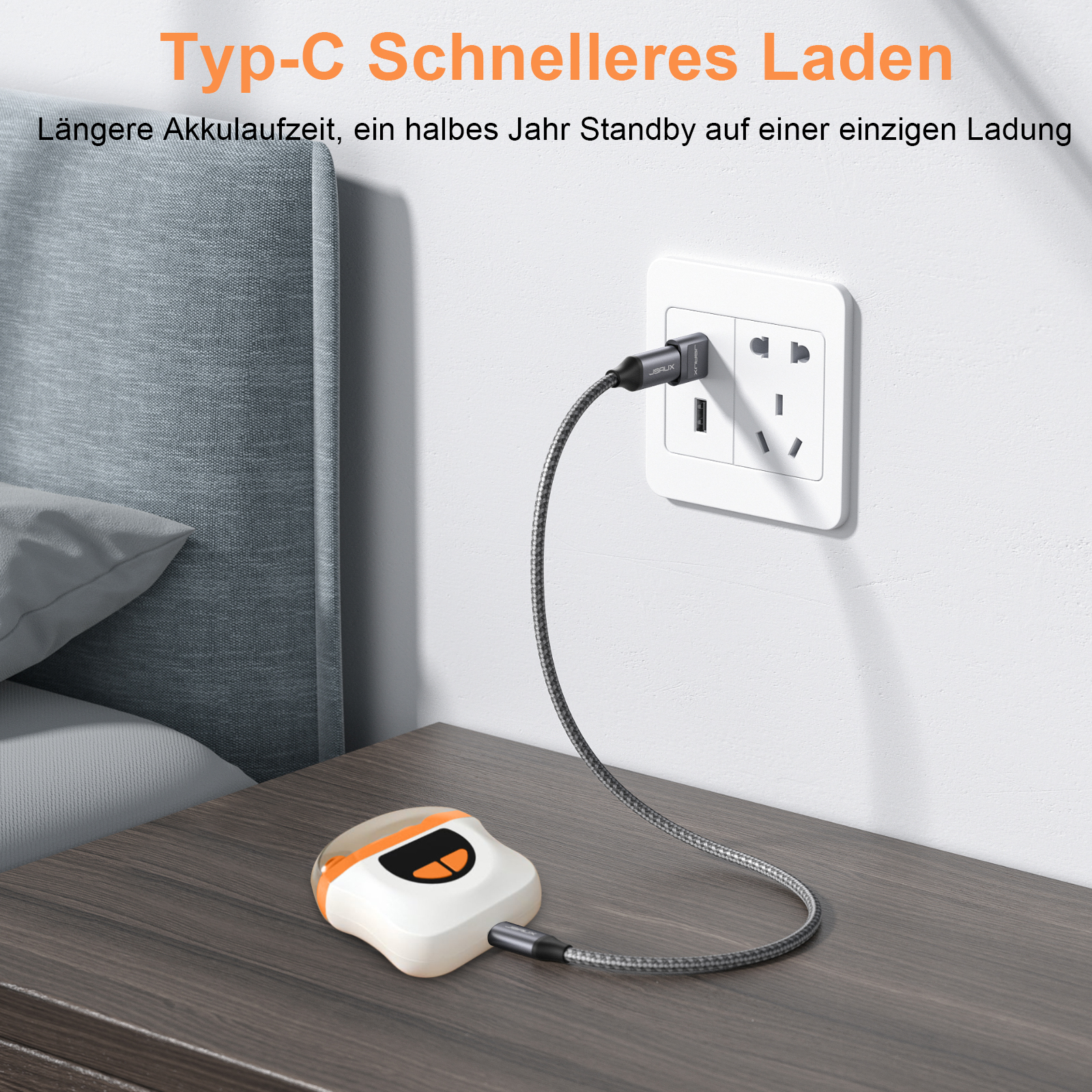 Weiß-oranger Nagelknipser, der in einer Steckdose geladen wird. Gerät auf Nachttisch, Kabel eingesteckt.