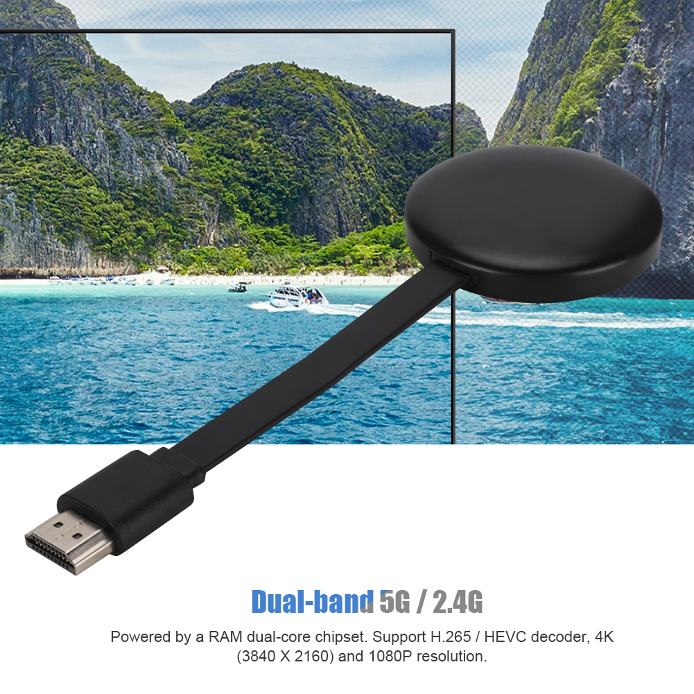 Ein schwarzes Gerät mit Kabel und HDMI-Anschluss und blauem Meer und Himmel als Hintergrund.