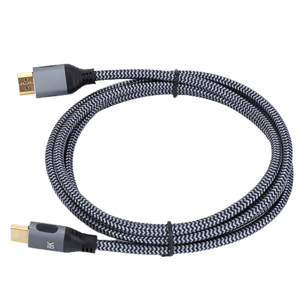 Schwarzes und graues HDMI-Kabel mit zwei Anschlüssen. Es ist aufgerollt und hat ein schwarzes Band.