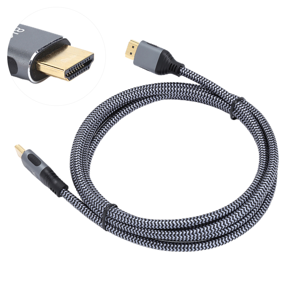 Ein aufgerolltes, schwarz-grau geflochtenes HDMI-Kabel mit goldenen Steckern und grauen Gehäusen.