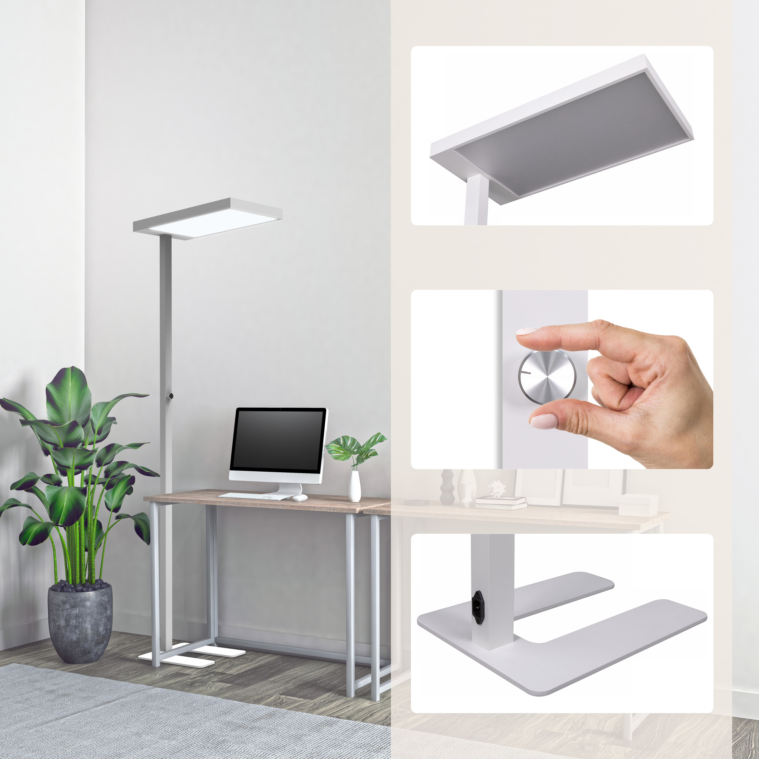 Eine moderne weiße Stehlampe neben einem Schreibtisch mit Computer, Pflanze und Knopf.
