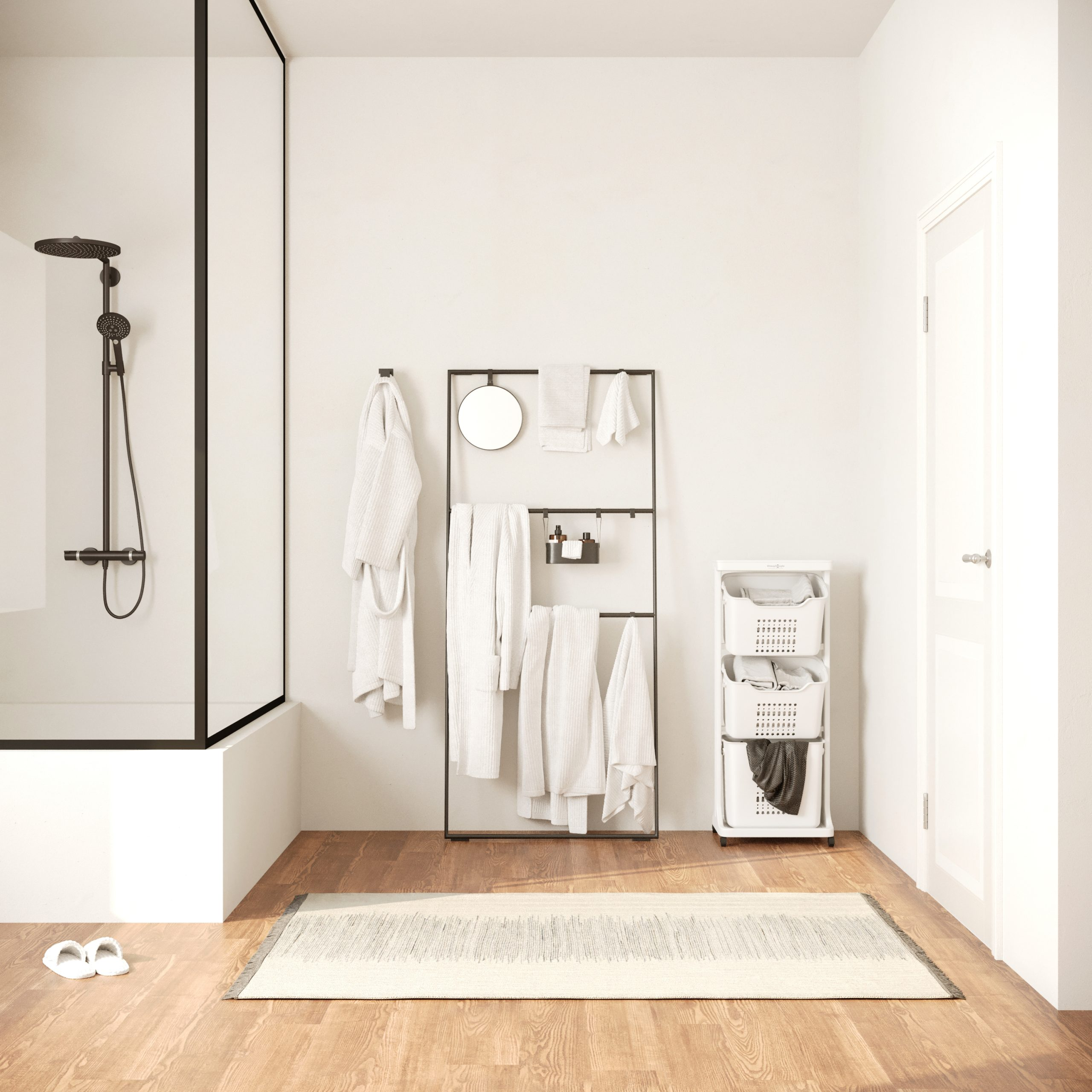 Une salle de bain avec une douche, un porte-serviettes et un trieur de linge. La pièce a un plancher en bois.