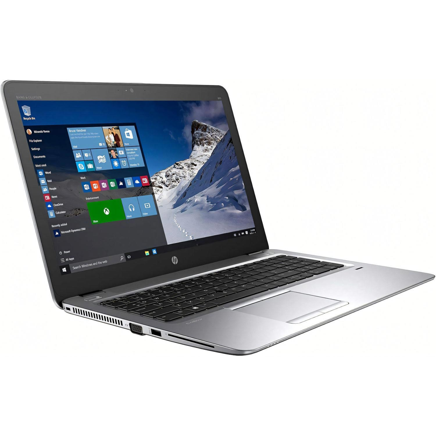 Portátil plateado, pantalla muestra interfaz Windows, teclado y panel táctil visibles. Fondo blanco.