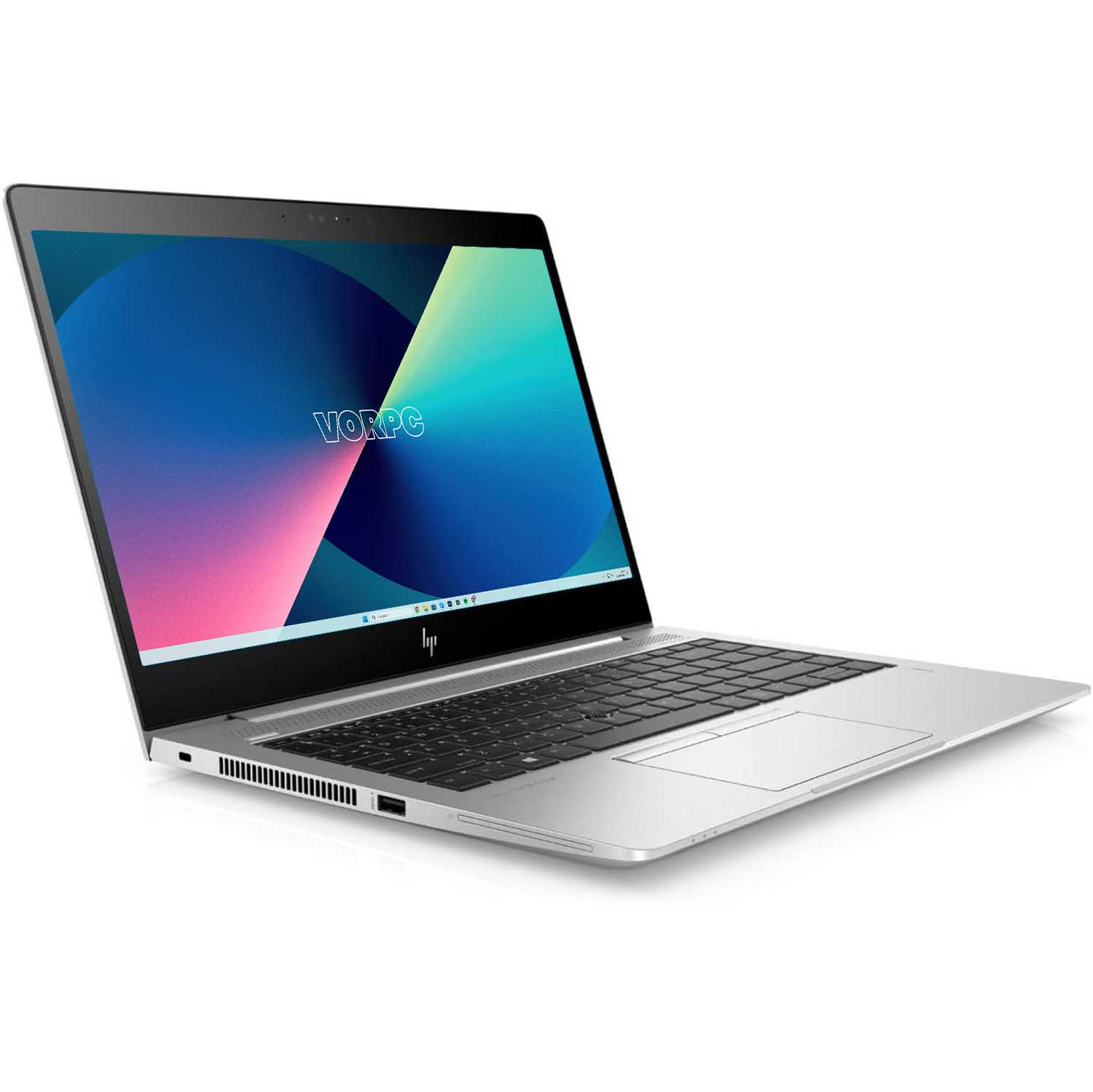 Laptop plateado con teclado negro. La pantalla muestra un diseño azul y verde con la palabra 'vorpc'.