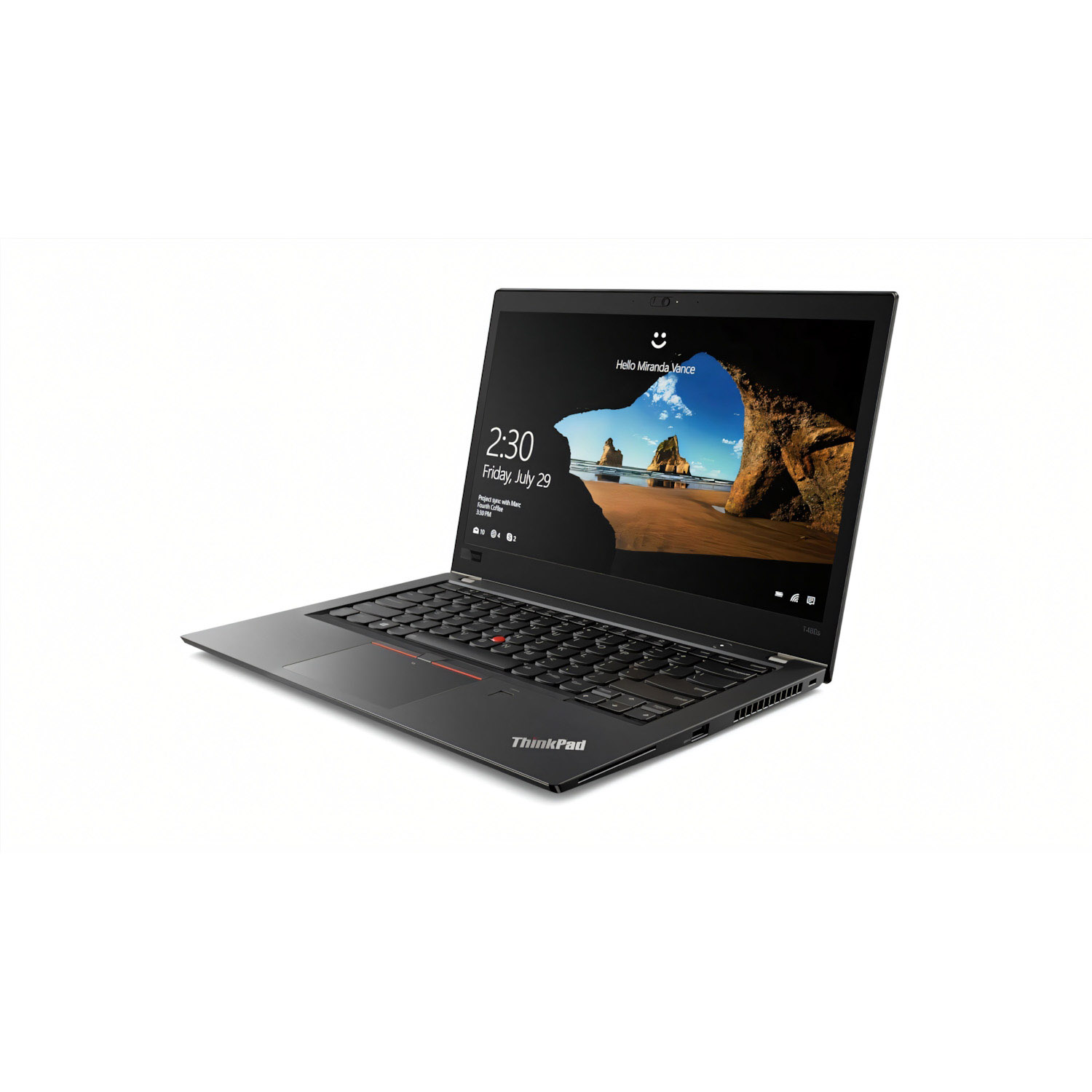 Laptop ThinkPad negro abierto, muestra escena de playa, teclado visible.