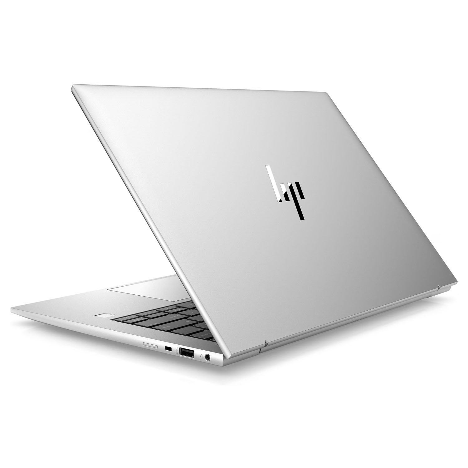 Laptop HP plateado desde atrás. El logo HP es visible. Vista en ángulo, sobre fondo blanco.
