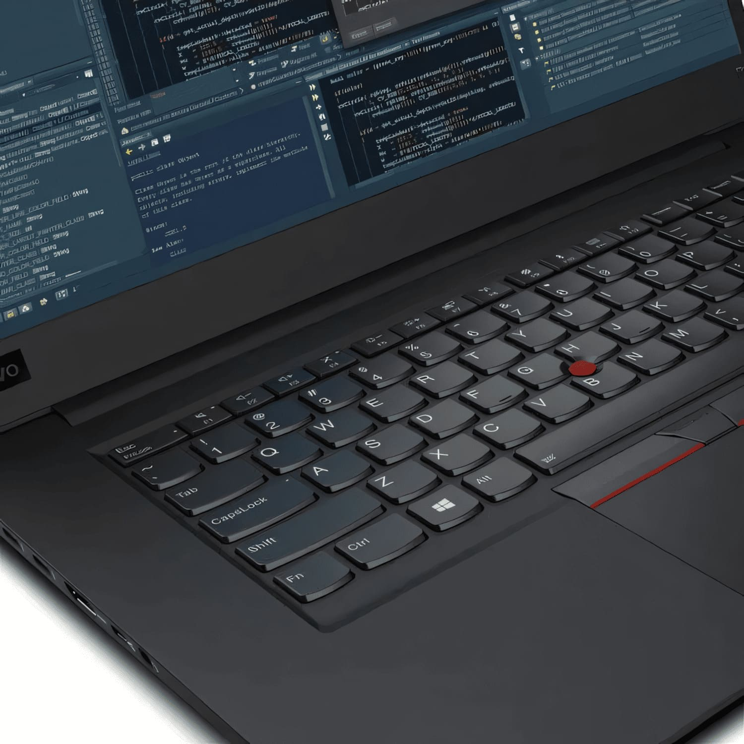Primer plano del teclado de un portátil negro con un trackpoint rojo, sobre fondo blanco.