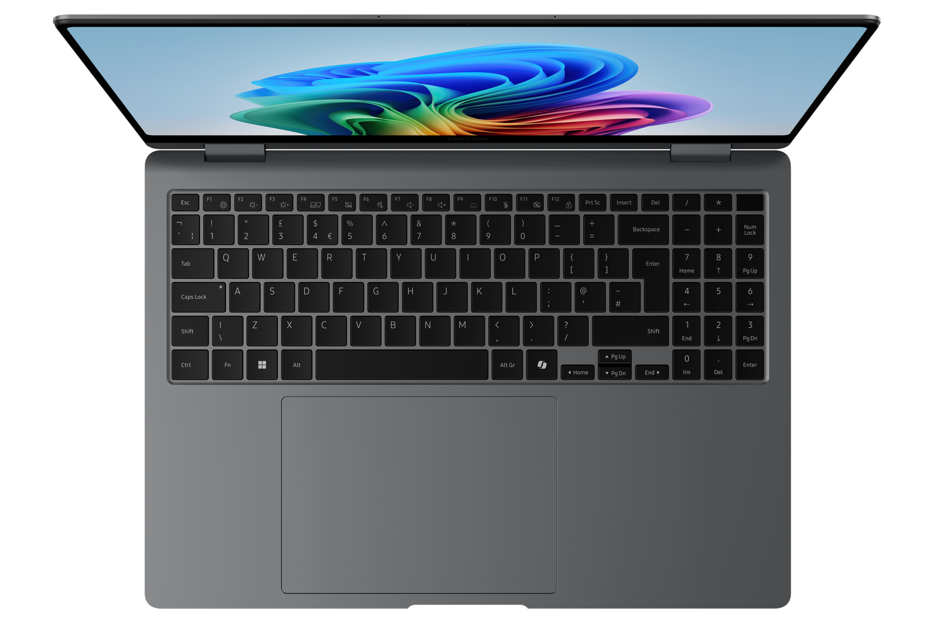 Vue de dessus d'un ordinateur portable gris ouvert. Le clavier est visible, avec un pavé tactile en dessous. L'écran est ouvert.