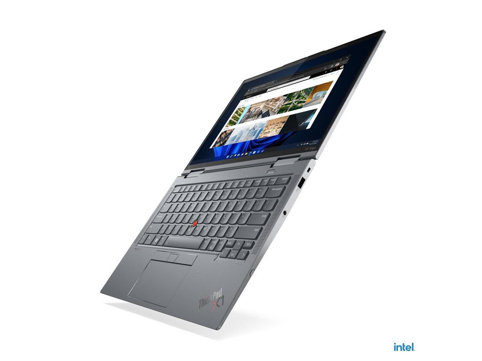 Laptop, schräg geöffnet, zeigt eine Webseite an. Tastatur sichtbar. Intel-Logo unten.