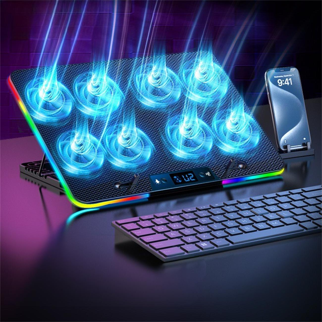 Ein schwarzes Kühlpad mit Lüftern und LED-Leuchten. Ein Telefon und eine Tastatur liegen auf dem Tisch.
