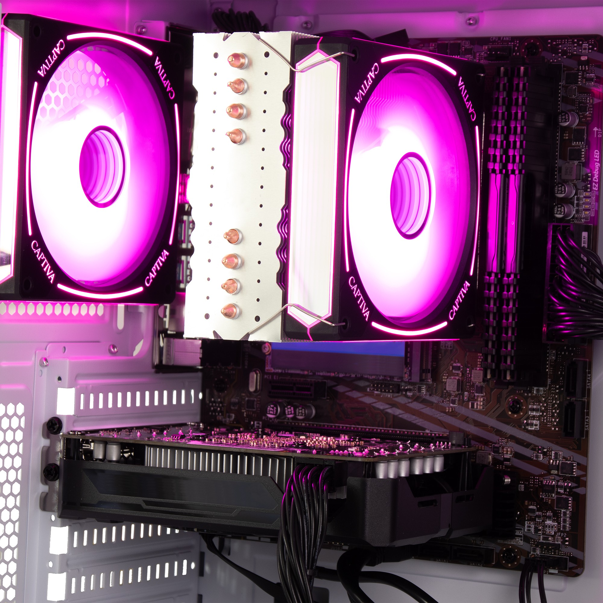 Zbliżenie wnętrza komputera z różowym oświetleniem RGB na wentylatorach i podzespołach.