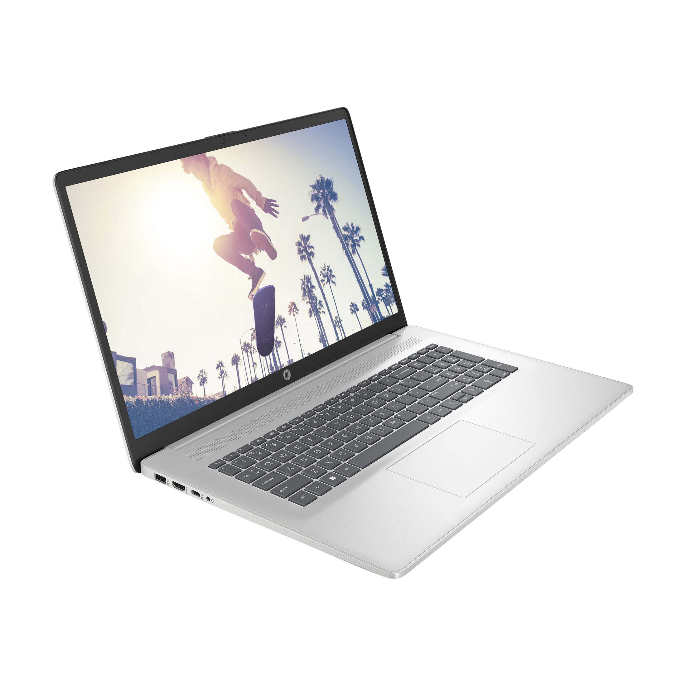 Offener silberner HP Laptop. Das Display zeigt einen Skateboarder vor Palmen.