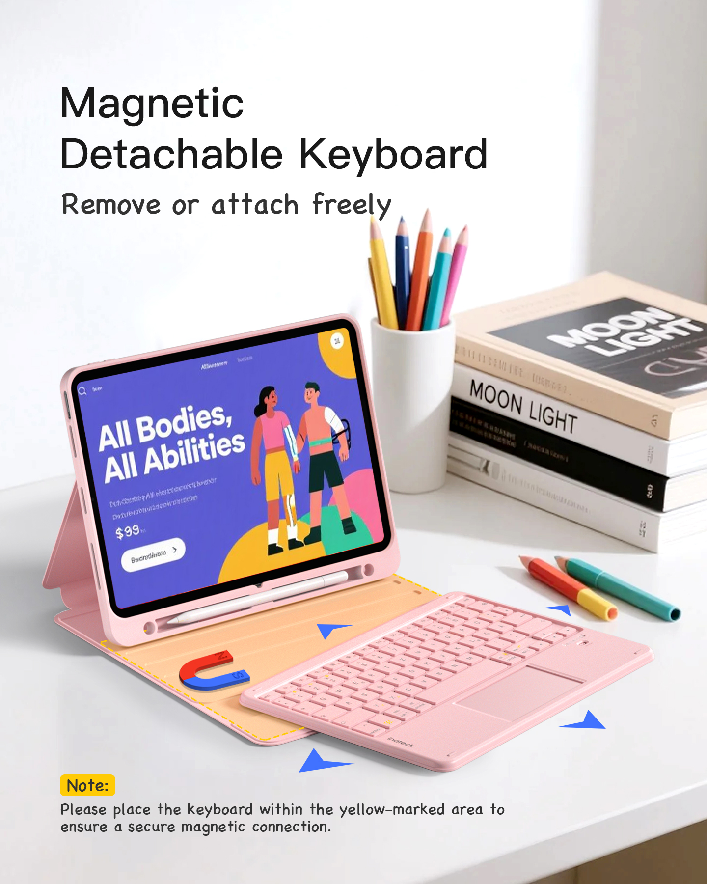Tablet und Tastatur mit magnetischer Verbindung, mit Bleistiften in einem Becher. Rosa und weißes Farbschema.