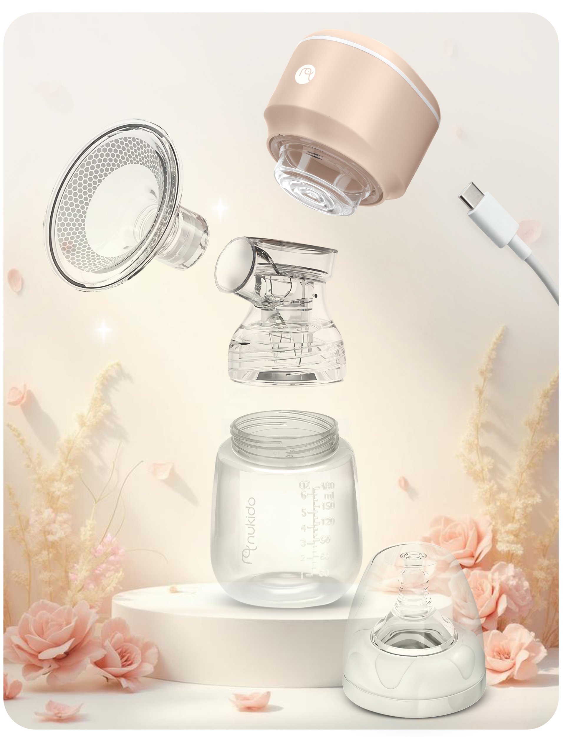 Laktator zdemontowany ze swoimi częściami i kablem USB-C.