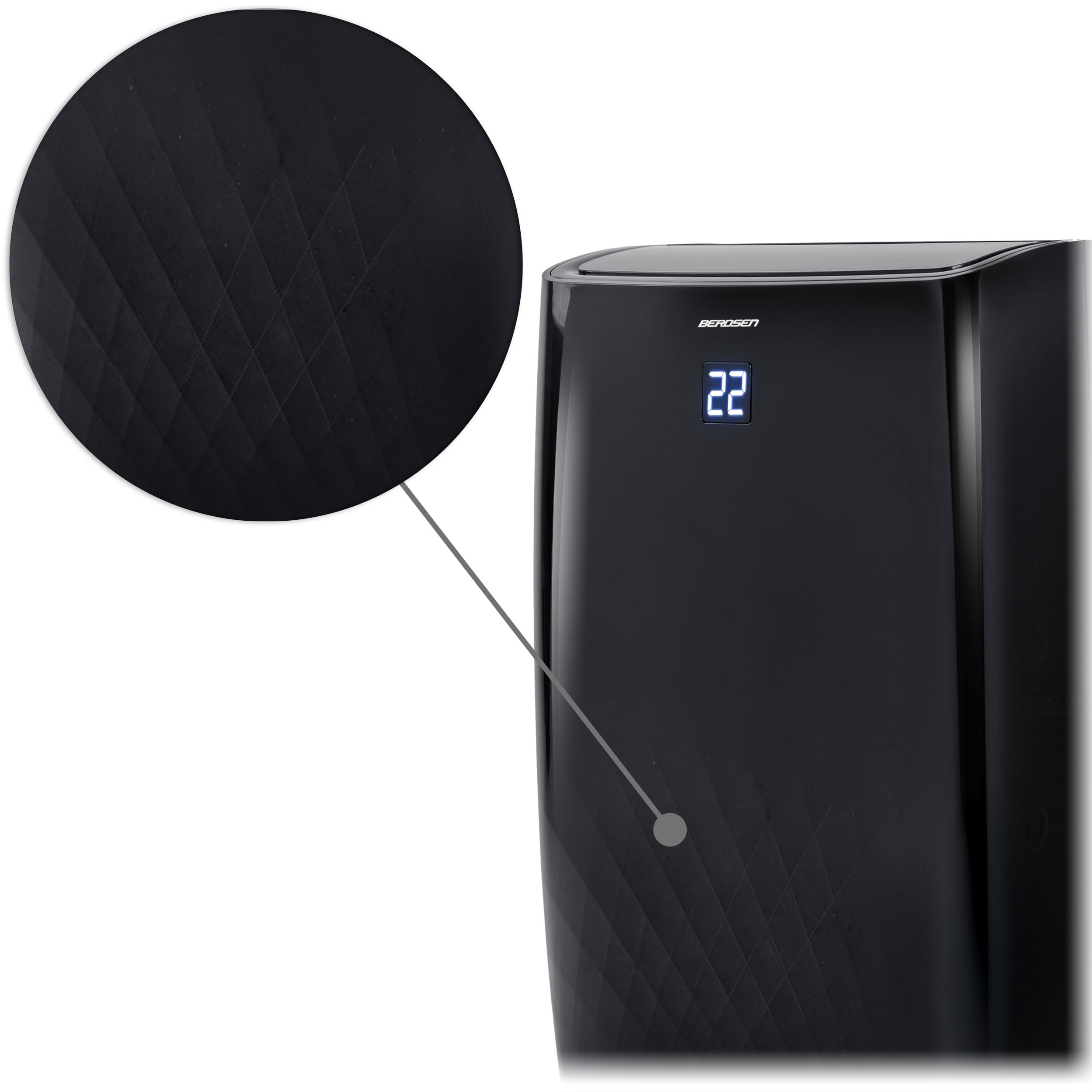 Zbliżenie czarnego klimatyzatora. Szczegół pokazuje wzór rombów i liczbę "22".