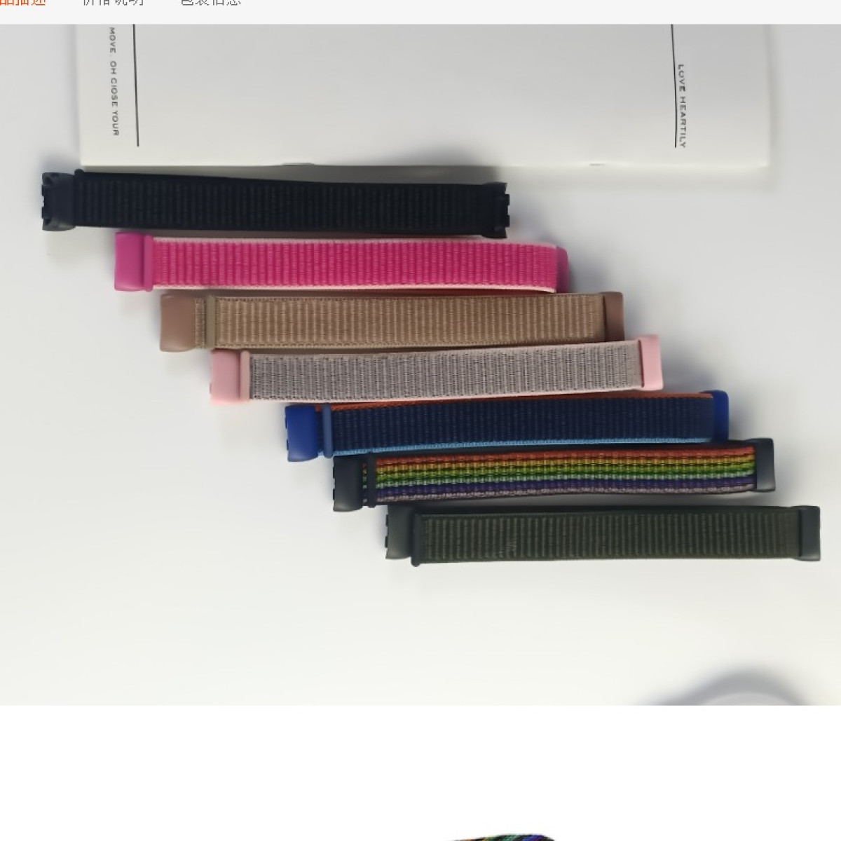 Assortimento di cinturini per orologi in vari colori, con una scatola sopra, su una superficie bianca.