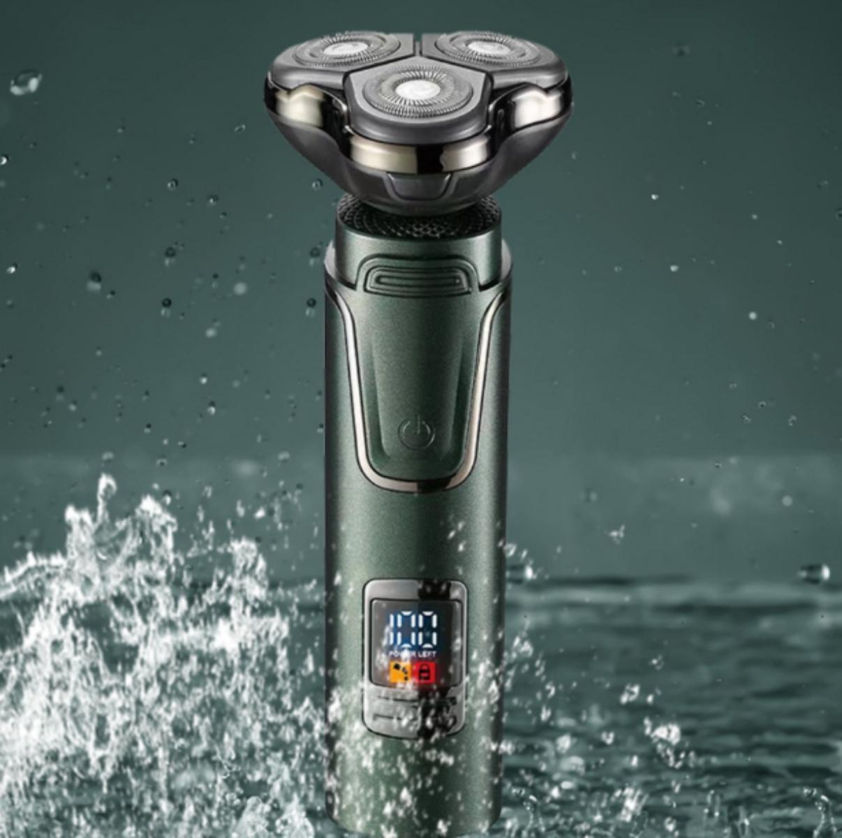 Ein grüner und grauer Elektrorasierer mit Wasserspritzern im Vordergrund.