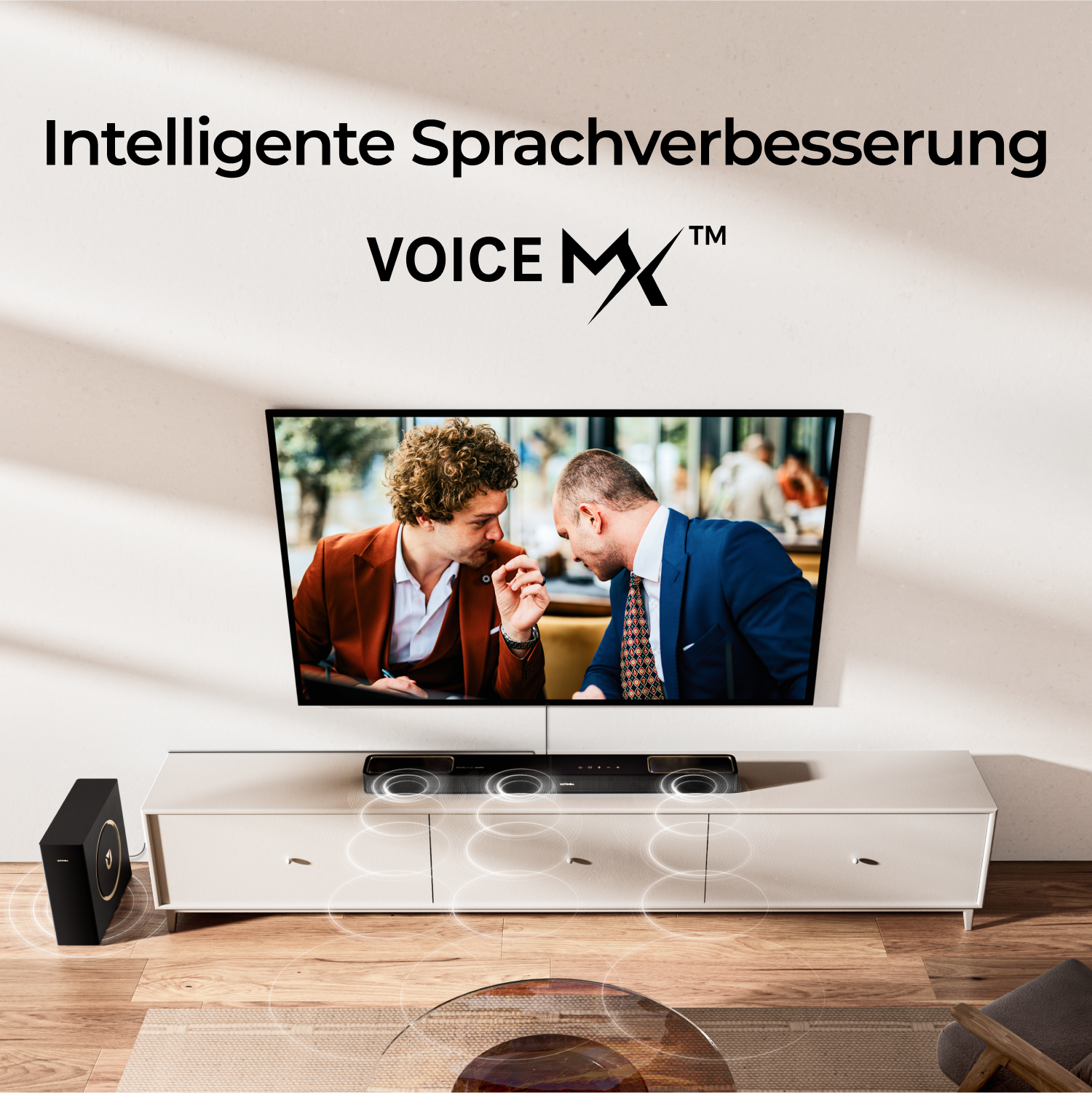 Telewizor wyświetlający dwóch mężczyzn w garniturach. Soundbar i subwoofer poniżej. Tekst: Inteligentny Voice MX, Voice MX.