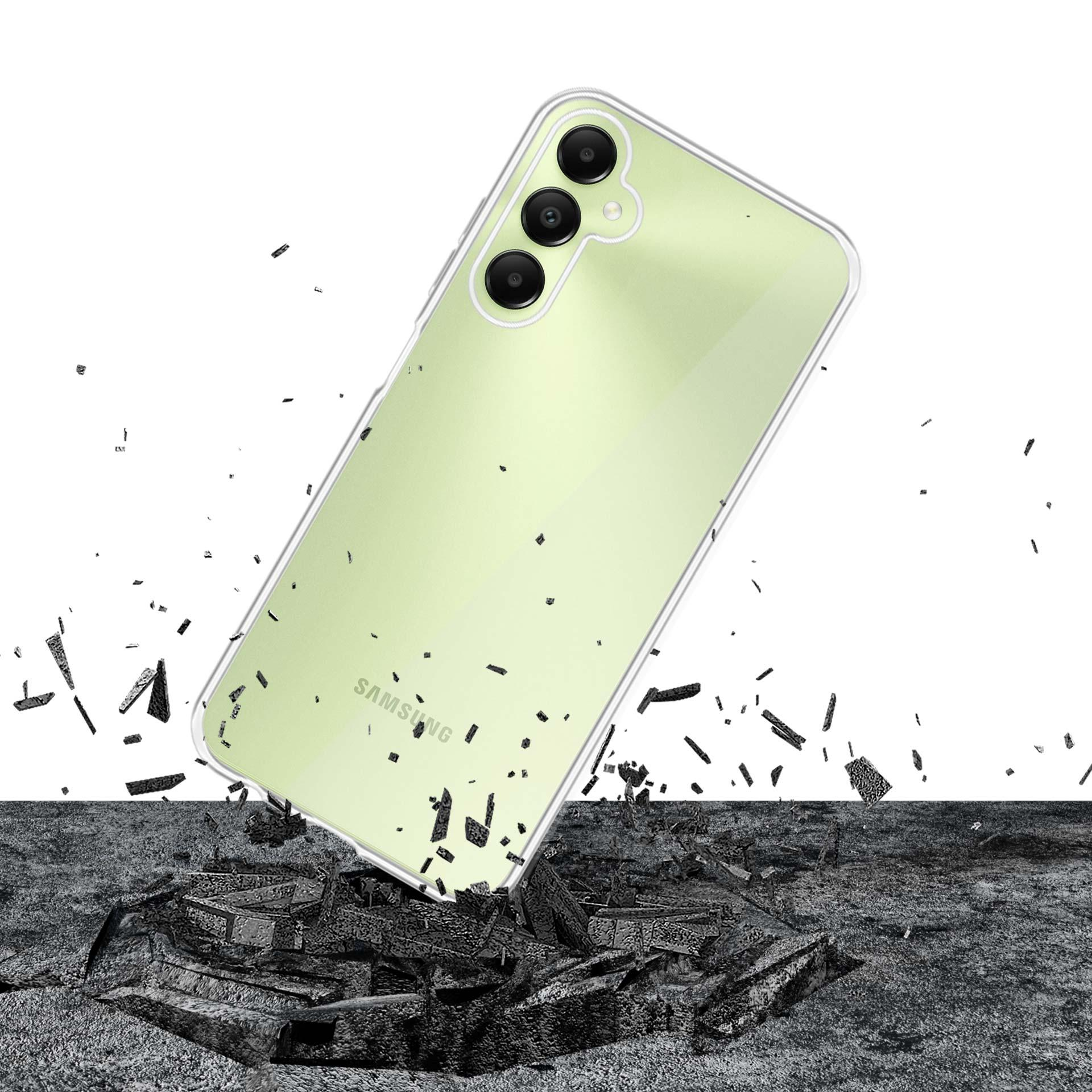 Telefono verde con custodia trasparente che si frantuma all'impatto. Detriti sparsi attorno al telefono.