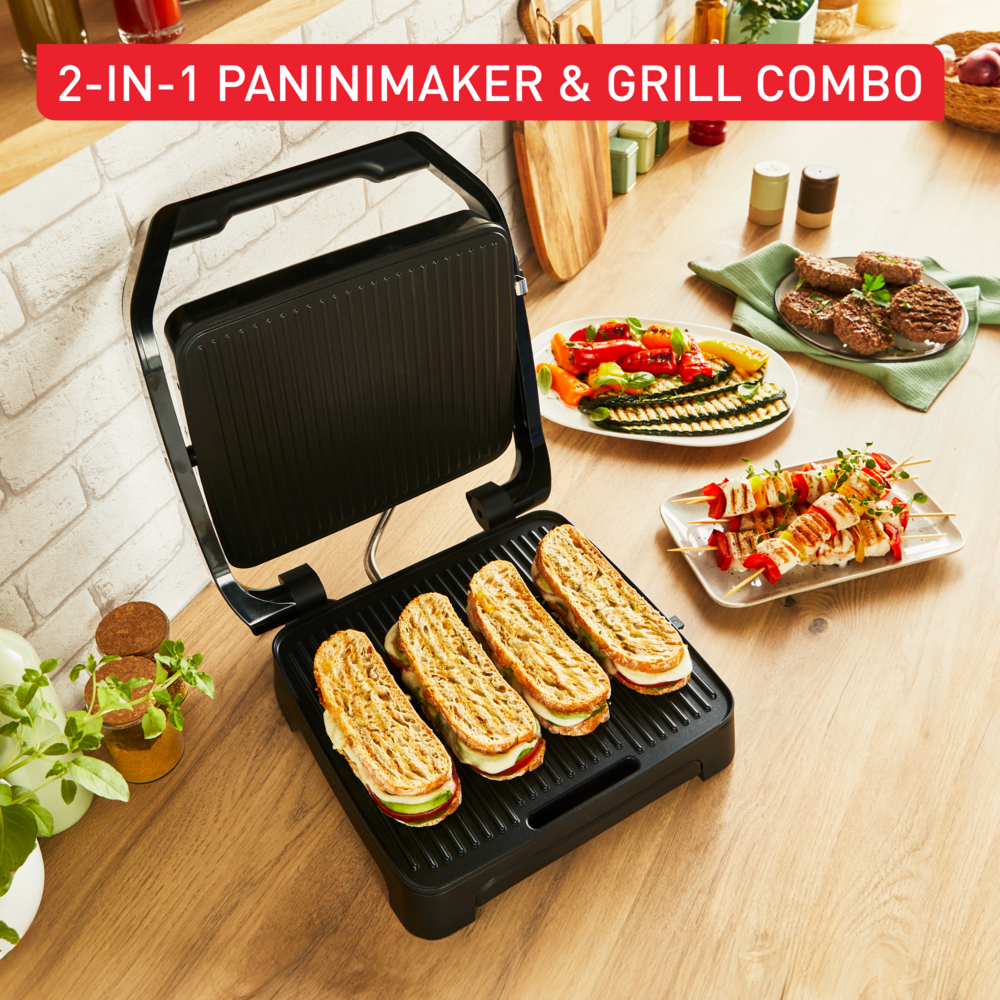 Schwarzer Panini-Maker mit Essen, auf Holztisch, Text: 2-in-1 Paninimaker & Grill Combo.