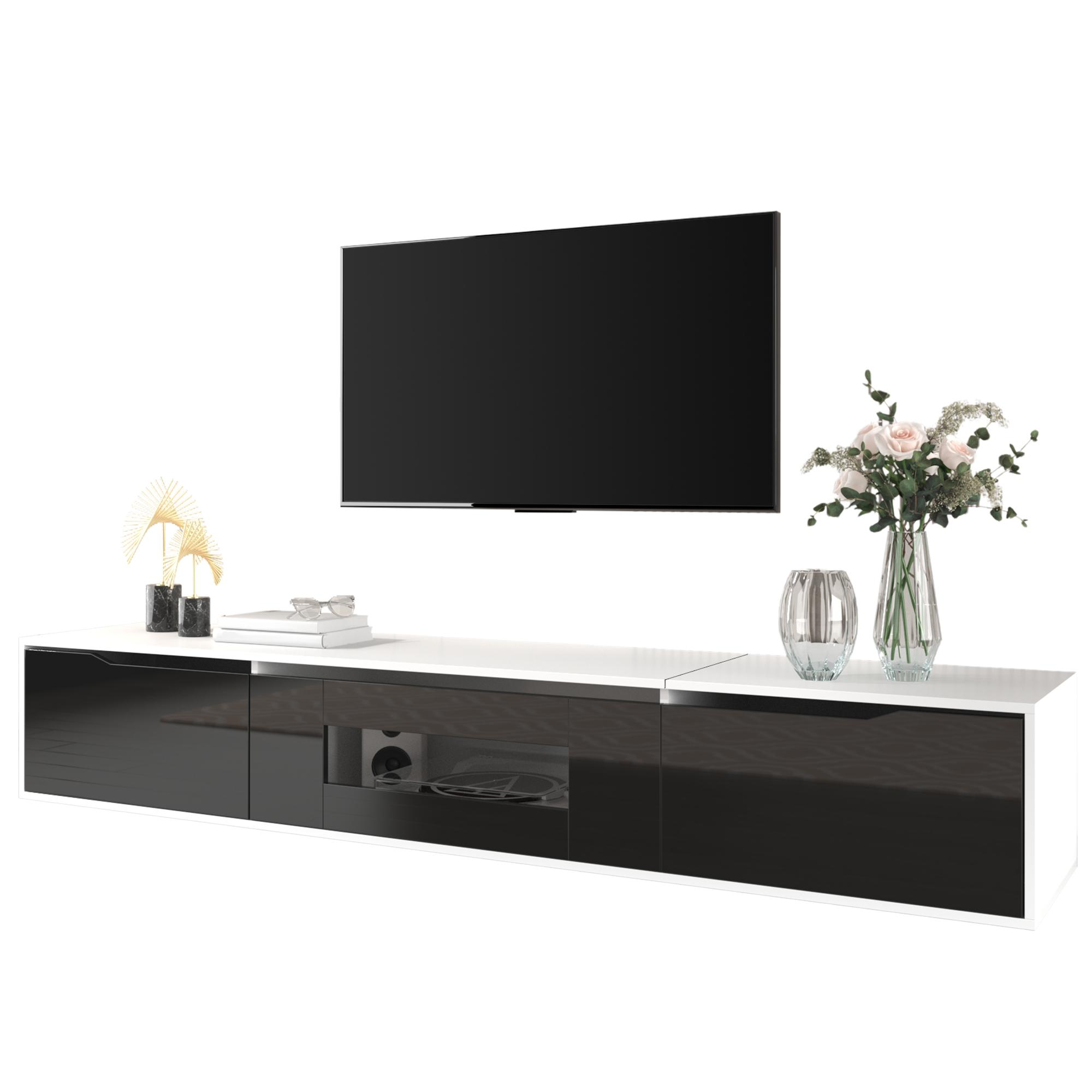 Ein moderner TV-Ständer mit schwarz-weißem Design, einem Fernseher und dekorativen Elementen. Der Ständer hat blaue Lichter.